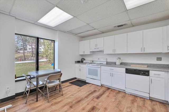 4 Glenna Dr, Carmel, NY 10512 - kitchen with light wood finished floors, a drop ceiling, under cabinet range hood, visible vents, and white appliances