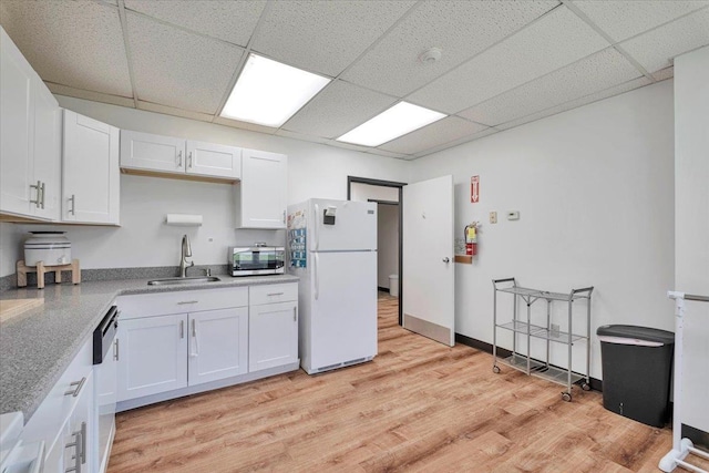 4 Glenna Dr, Carmel, NY 10512 - kitchen with a sink, appliances with stainless steel finishes, light countertops, white cabinetry, and a paneled ceiling