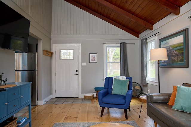 foyer entrance featuring wooden ceiling, beam ceiling, high vaulted ceiling, light wood-type flooring, and baseboards