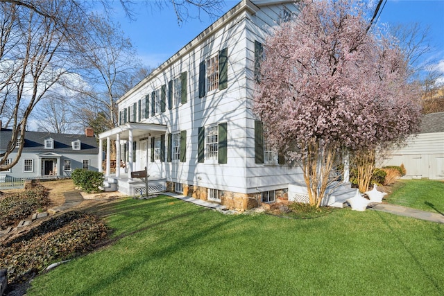 view of property exterior with a yard