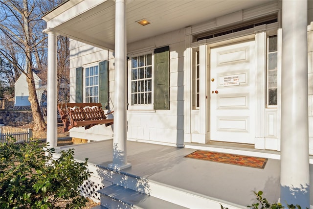 entrance to property with a porch