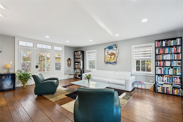 living room with hardwood / wood-style floors and recessed lighting