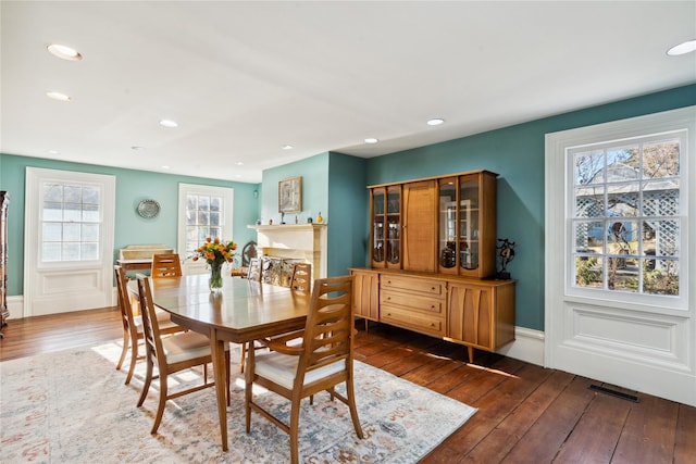 dining area featuring recessed lighting, hardwood / wood-style floors, and visible vents