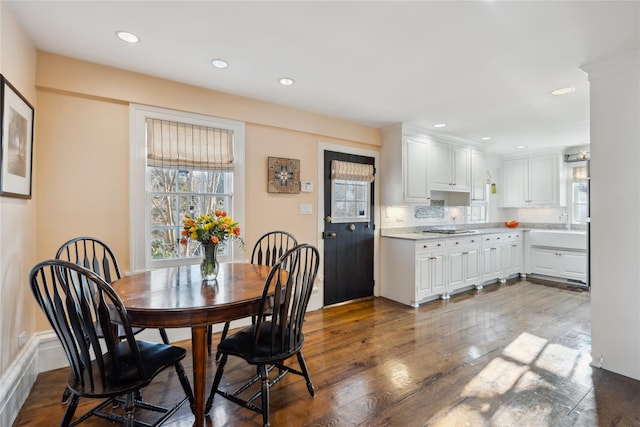 dining space with recessed lighting and hardwood / wood-style floors