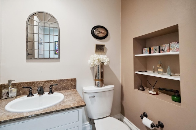 bathroom with toilet and vanity