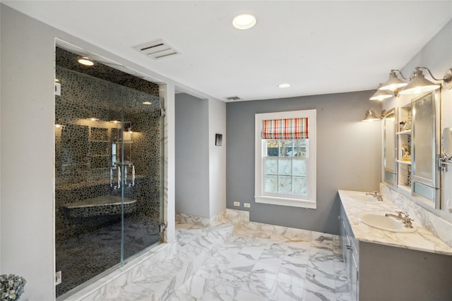 bathroom featuring recessed lighting, visible vents, a sink, and marble finish floor