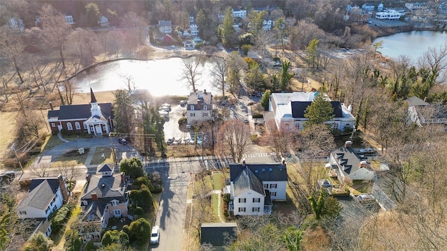 bird's eye view featuring a residential view and a water view