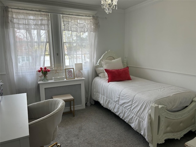 carpeted bedroom featuring a chandelier and crown molding