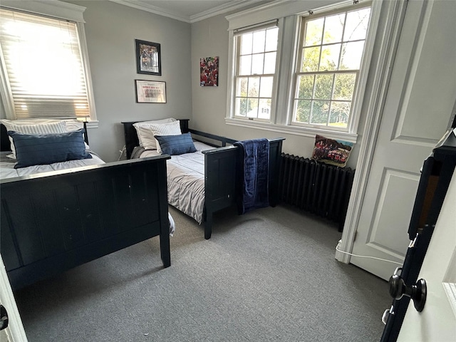 carpeted bedroom featuring radiator heating unit and ornamental molding
