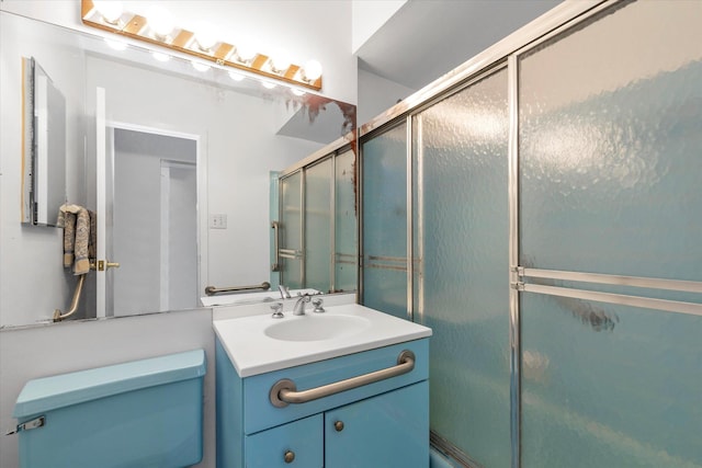 full bathroom featuring vanity and toilet