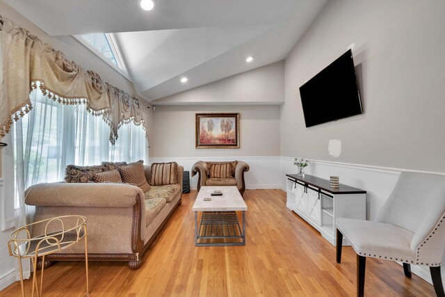 92 Dovecote Ln, Commack, NY 11725 - living area with recessed lighting, vaulted ceiling, plenty of natural light, and light wood finished floors