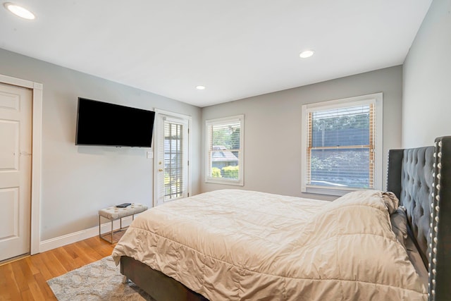 92 Dovecote Ln, Commack, NY 11725 - bedroom with recessed lighting, light wood finished floors, baseboards, and access to exterior