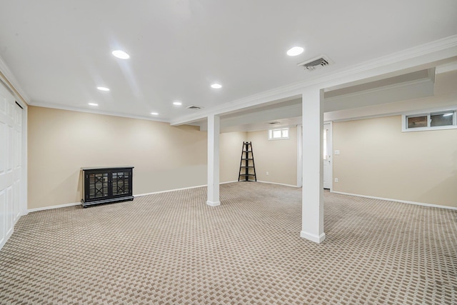 92 Dovecote Ln, Commack, NY 11725 - below grade area featuring light colored carpet, ornamental molding, baseboards, and visible vents