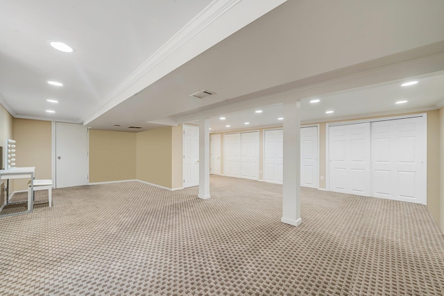 92 Dovecote Ln, Commack, NY 11725 - finished below grade area featuring crown molding, visible vents, light carpet, baseboards, and recessed lighting