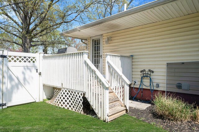 92 Dovecote Ln, Commack, NY 11725 - doorway to property with fence, a gate, and a lawn