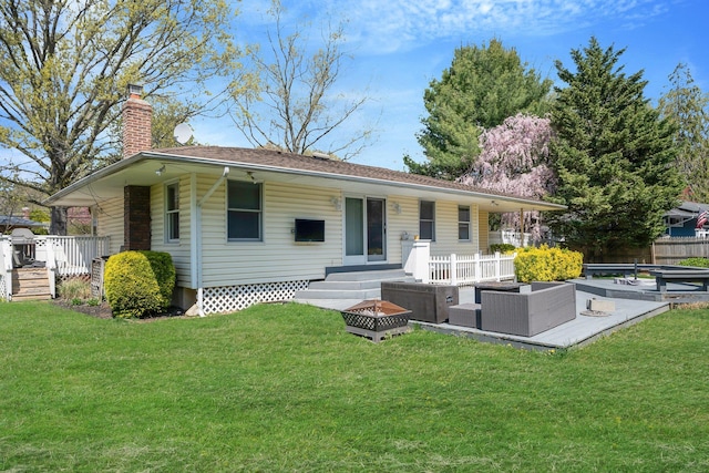 92 Dovecote Ln, Commack, NY 11725 - rear view of house featuring an outdoor living space with a fire pit, a yard, and a chimney