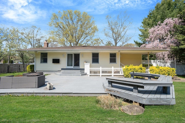 92 Dovecote Ln, Commack, NY 11725 - rear view of property featuring fence, a wooden deck, a chimney, and a lawn