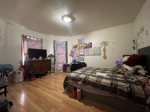 bedroom featuring wood finished floors