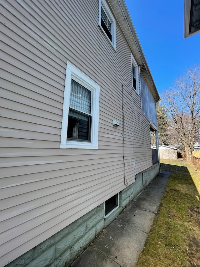 view of side of property with fence