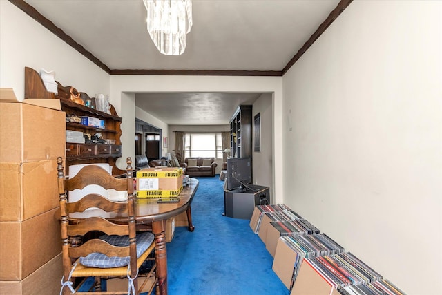 3530 Long Beach Rd Unit 68, Oceanside, NY 11572 - dining space featuring carpet floors, ornamental molding, and an inviting chandelier