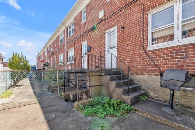 3530 Long Beach Rd Unit 68, Oceanside, NY 11572 - view of property exterior with brick siding and fence