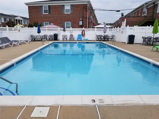 3530 Long Beach Rd Unit 68, Oceanside, NY 11572 - pool featuring a patio and a fenced backyard