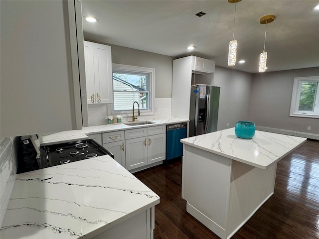 38 Moffitt Blvd, East Islip, NY 11730 - kitchen with stainless steel fridge, dishwasher, a sink, a center island, and light stone countertops