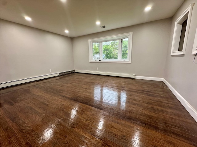 38 Moffitt Blvd, East Islip, NY 11730 - unfurnished room featuring baseboard heating, dark wood-style floors, baseboards, and recessed lighting