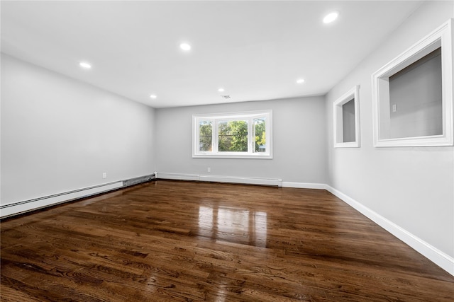 38 Moffitt Blvd, East Islip, NY 11730 - empty room featuring a baseboard heating unit, recessed lighting, dark wood-style flooring, and baseboards