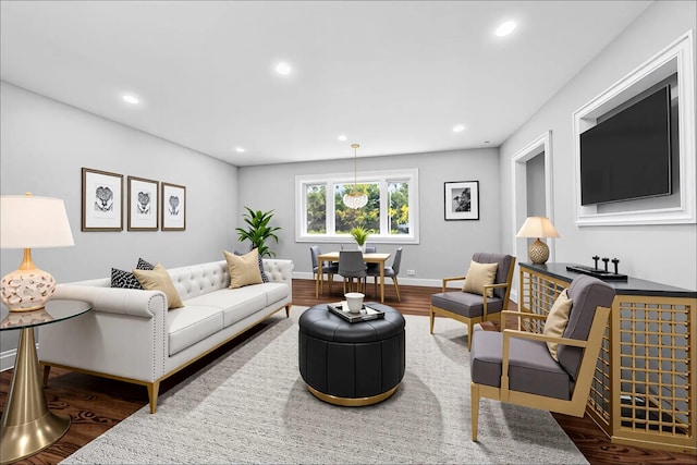 38 Moffitt Blvd, East Islip, NY 11730 - living area featuring wood finished floors, recessed lighting, and baseboards