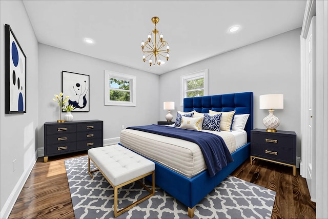 38 Moffitt Blvd, East Islip, NY 11730 - bedroom featuring a chandelier, dark wood-style floors, baseboards, and recessed lighting