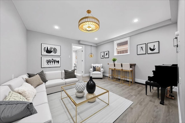 38 Moffitt Blvd, East Islip, NY 11730 - living area with wood finished floors, recessed lighting, and baseboards