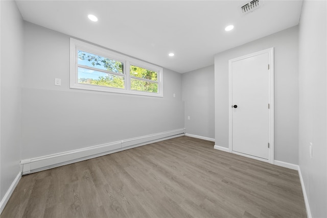 38 Moffitt Blvd, East Islip, NY 11730 - empty room with baseboards, wood finished floors, and recessed lighting