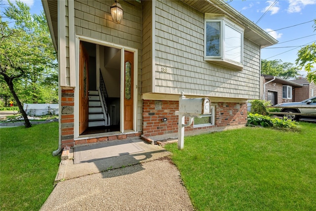 38 Moffitt Blvd, East Islip, NY 11730 - entrance to property with a yard and brick siding