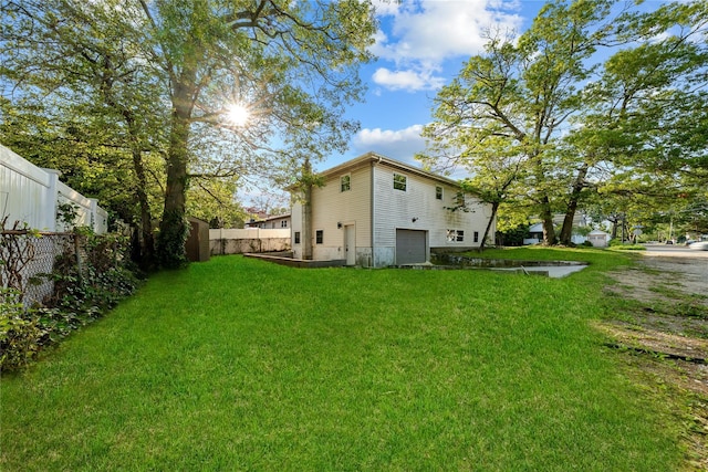 38 Moffitt Blvd, East Islip, NY 11730 - rear view of house featuring an attached garage