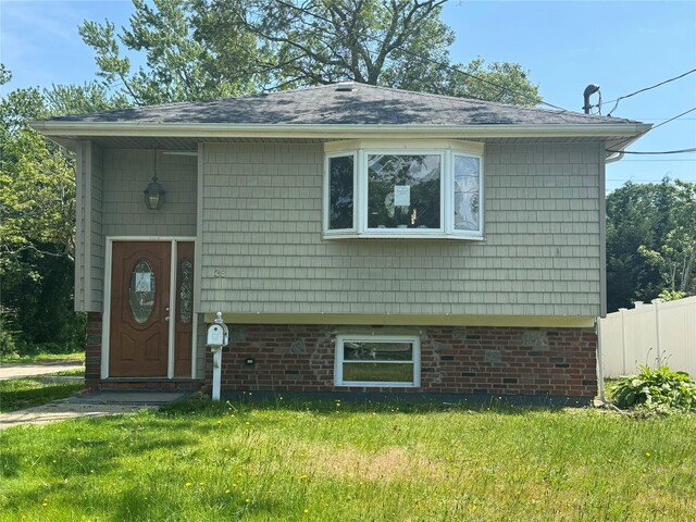 38 Moffitt Blvd, East Islip, NY 11730 - view of front facade featuring roof with shingles