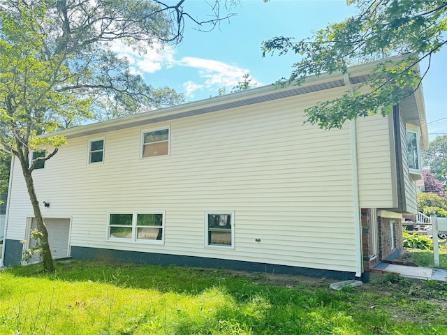 38 Moffitt Blvd, East Islip, NY 11730 - back of property featuring a garage