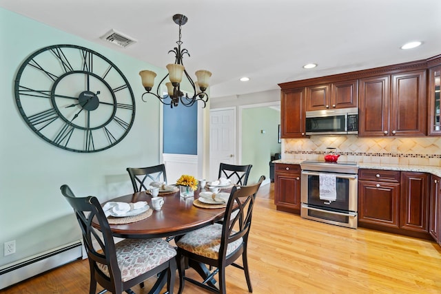 dining area featuring recessed lighting, an inviting chandelier, visible vents, light wood-type flooring, and baseboard heating