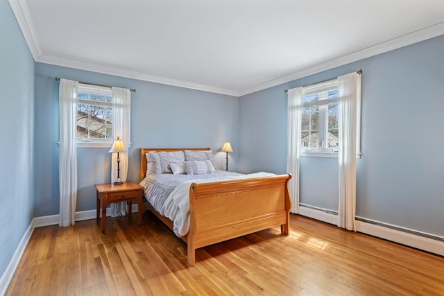 bedroom featuring light wood-type flooring, baseboards, crown molding, and multiple windows