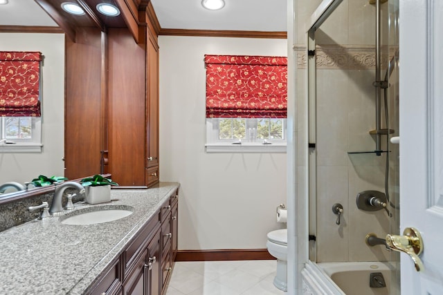 full bath featuring tile patterned floors, toilet, baseboards, vanity, and ornamental molding