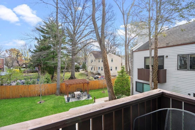 exterior space with a yard, fence private yard, a patio, and a residential view