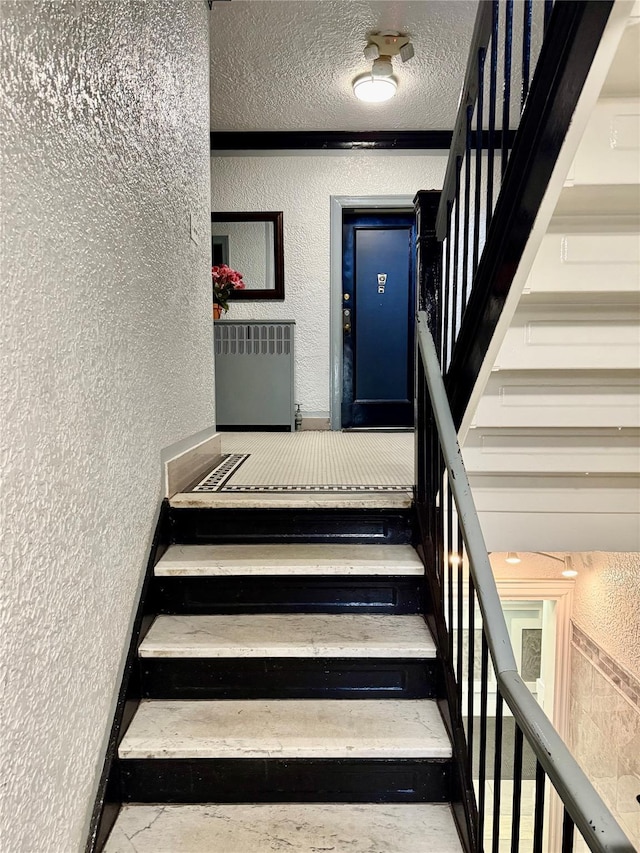 2 Lockwood Ave Unit 2B, Bronxville, NY 10708 - stairs featuring a textured wall and a textured ceiling