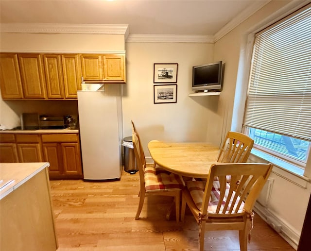 2 Lockwood Ave Unit 2B, Bronxville, NY 10708 - dining space with ornamental molding and light wood-style flooring