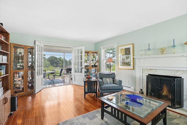 1449 Riverview Ave, Peekskill, NY 10566 - living area with french doors, healthy amount of natural light, and wood finished floors