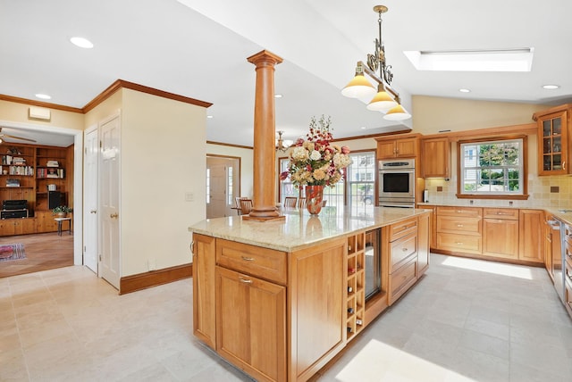 1449 Riverview Ave, Peekskill, NY 10566 - kitchen featuring ornate columns, decorative backsplash, vaulted ceiling, double oven, and glass insert cabinets