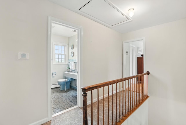 1449 Riverview Ave, Peekskill, NY 10566 - hallway with attic access, an upstairs landing, and a baseboard radiator