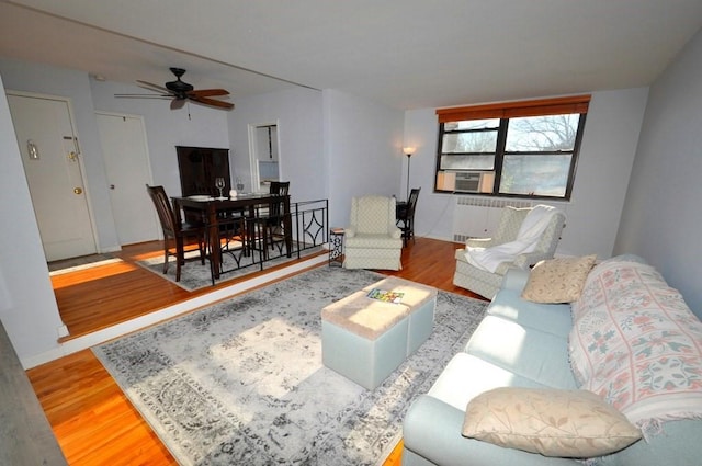 66 Rockledge Rd Unit 1B, Hartsdale, NY 10530 - living area featuring radiator, light wood finished floors, baseboards, cooling unit, and ceiling fan