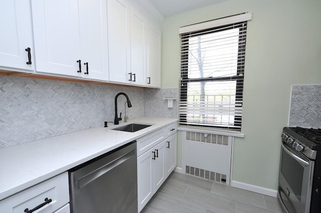 66 Rockledge Rd Unit 1B, Hartsdale, NY 10530 - kitchen featuring tasteful backsplash, a sink, plenty of natural light, stainless steel appliances, and radiator
