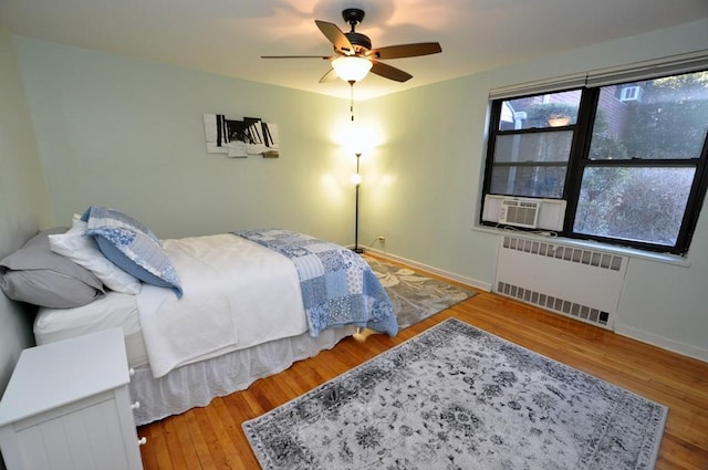 66 Rockledge Rd Unit 1B, Hartsdale, NY 10530 - bedroom with baseboards, radiator heating unit, cooling unit, and wood finished floors