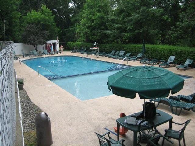 66 Rockledge Rd Unit 1B, Hartsdale, NY 10530 - pool with fence and a patio area